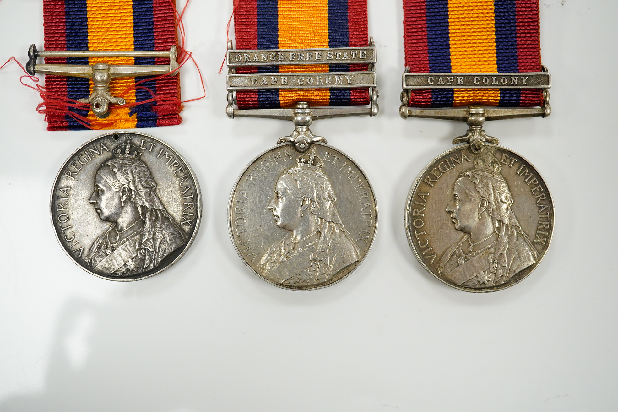 Queens South Africa Medal with CC clasp to 4493 Pte J.Finan, W.York:Regt, another with OFS and CC clasps to 3414 Pte E.Barnett, RL Fus and a third with detached disc to Sapr G Streeter, R.E.